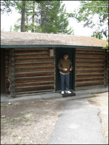Picture of Jim in front of our cabin at Colter Bay Village.