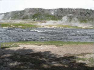 Picture of the Old Faithful Geyser Basin area and Firehole River.