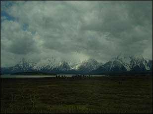 Picture of Grand Tetons against stormy skies.